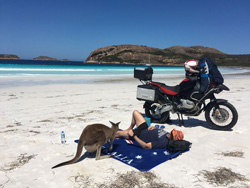 Photo by Mrs. Candi Toll (Australia) of Mr. Jamie Toll in Western Australia, resting with a local and her joey at Lucky Bay, Esperance, next to his 2008 BMW 1200GS Adventure.