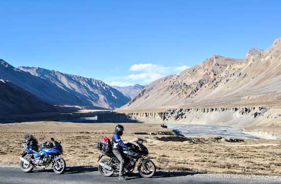 Maria and Aidan's bikes and an India mountain vista.