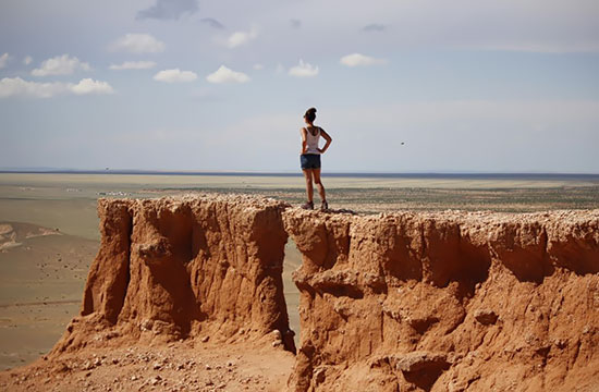 Ivette Montalvo takes in a vista from a cliff