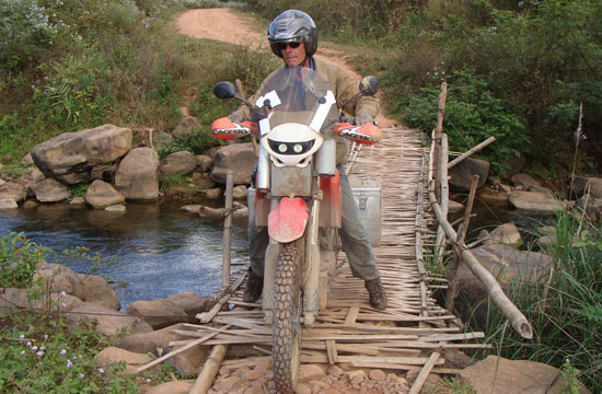 Yves Besancon crossing a bridge