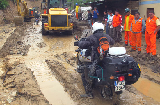 Horst riding through very wet mud.