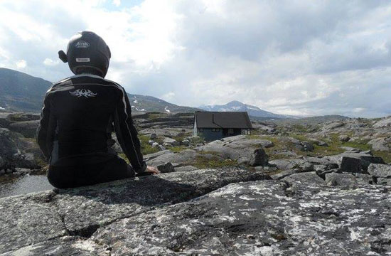 Olga sitting on a rock.