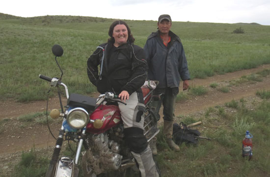 Andrea on her bike in Mongolia