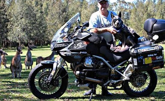 Tex O'Grady and Bundy with motorcycle.