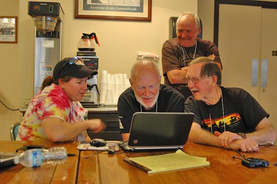 Dana Beisner (left) tutors Dave Despain (center) on Garmin's BaseCamp mapping software at HU Virginia 2015.