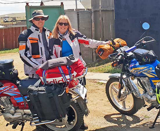 Lyn and Peter Mawby with their bikes.