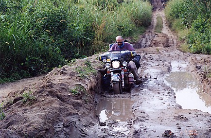 The Harley on muddy roads in the Congo.