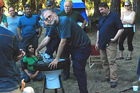 Grant demonstrates the fine art of tire changing at the California 2009 meeting.