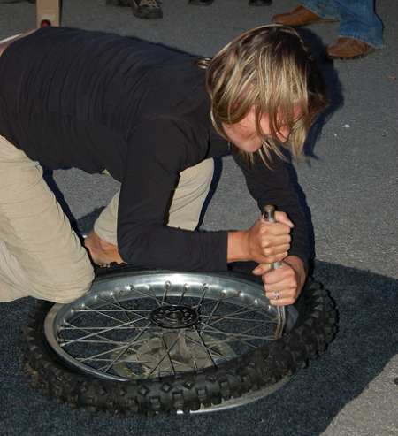 Zoe just about to finish the tyre change. 