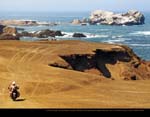 March by Peter Russell, of Petra Russell, Canada, Riding on the coastal dunes outside Huarmey, Peru, from Buenos Aires to Toronto, 2009 KLR650.