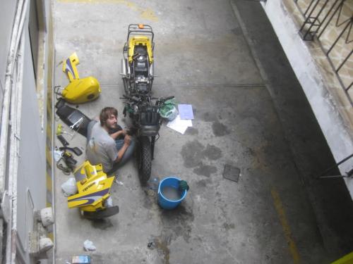 Jordan cleaning the bike for sale, Peru.