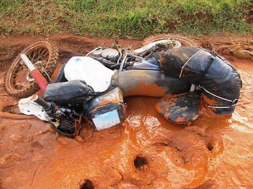 Tiffany Coates bike in mud, Madagascar.